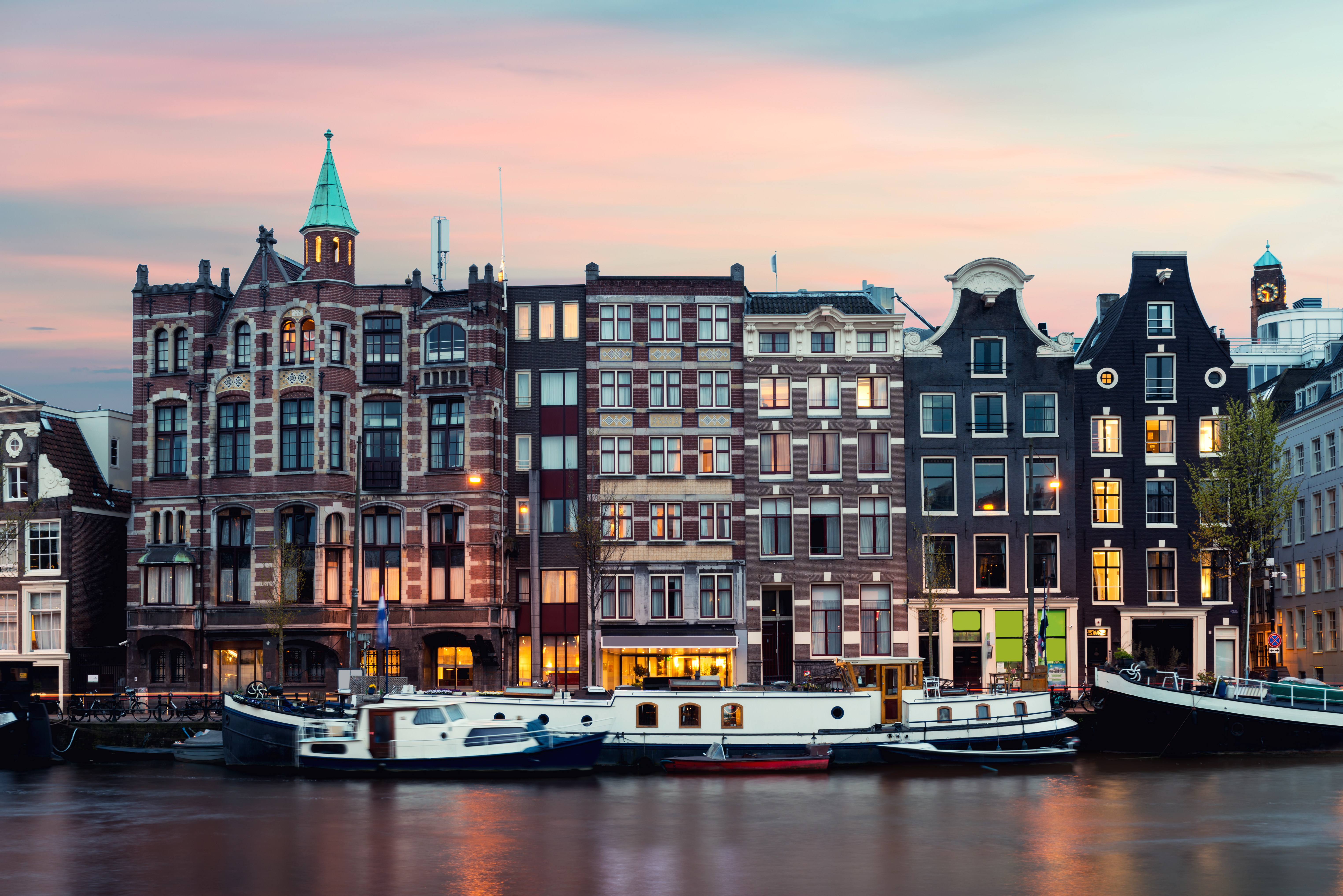 Night Amsterdam city view of Netherlands traditional houses with